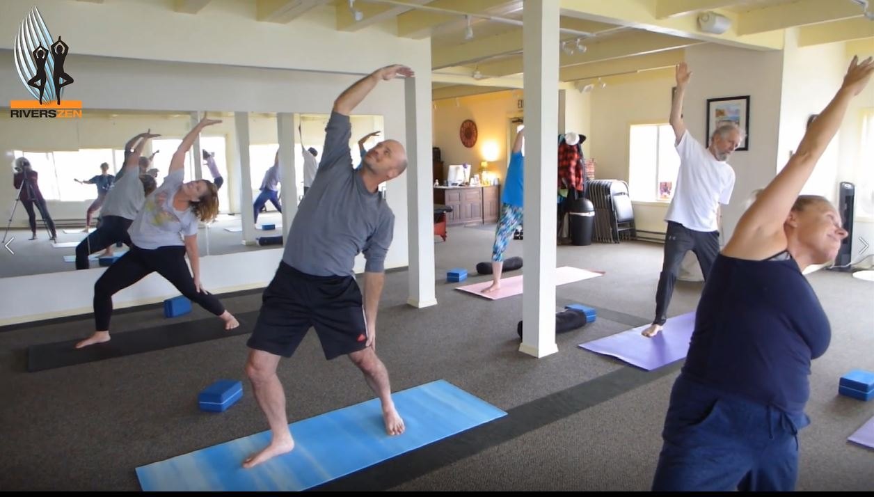 A live RiversZen class in the Astoria studio with students doing the same standing movement in their own way